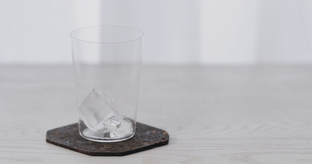 big ice rock into tumbler glass