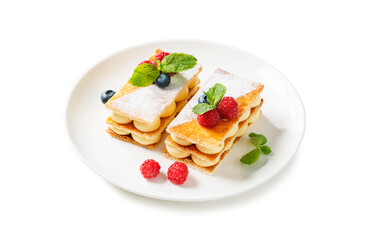 Classic french dessert millefeuille with vanilla cream and fresh berries. isolated on white background	