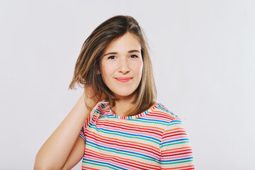 Fototapeta premium Studio portrait of young happy model, wearing rainnbow t-shirt