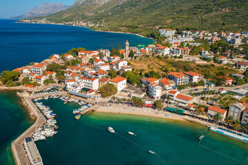 Aerial view of Gradac town below Biokovo mountain, the Adriatic Sea, Croatia - obrazy, fototapety, plakaty