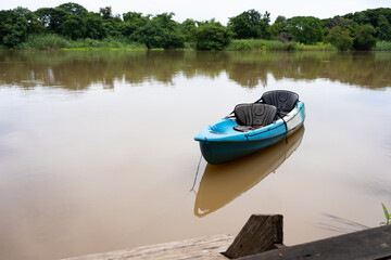 Fototapeta na wymiar canoe boat floating on river