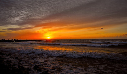 Sunset on the sea. Evening, evening sea, sunset. Beautiful evening landscape, surfing and waves, sunset
