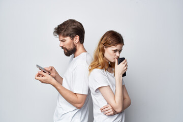 a young couple quarrel jealousy telephones communication studio lifestyle