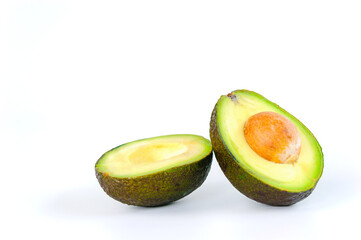 avocado cut in half on a white background