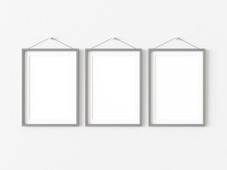 Three rectangular pictures with thin grey border hanging on white wall. Empty template for adding your content. 3D illustration.