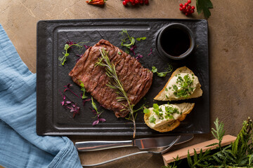 Butcher's steak, on a stone plate