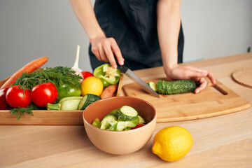 Obraz na płótnie Canvas chef in the kitchen cutting vegetables vitamins housework