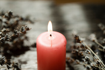 burning candle on a dark background