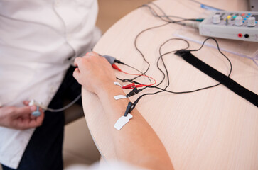 Patient nerves testing using electromyography at medical center