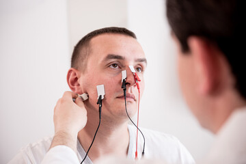 Patient nerves testing using electromyography at medical center