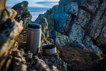 thermos flask on the rocks
