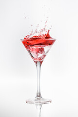 cocktail glass with moving red liquid