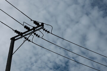 electric pole against blurred background of sky