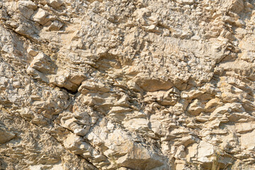 Curious rock formations on the side of a mountain, with detail of the veins and sedimentation layers.
