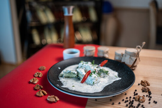 traditional georgian food gebjalia with matsoni cheese and red chili pepper