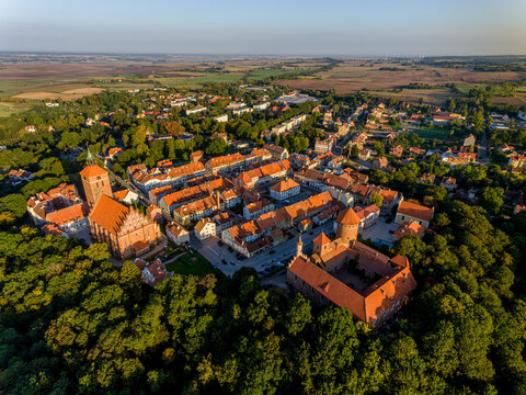 Panorama of the city of Reszel at sunrise, Castle and the Church of the Holy Apostles Peter and Paul in Reszel - Warmia and Masuria, Poland