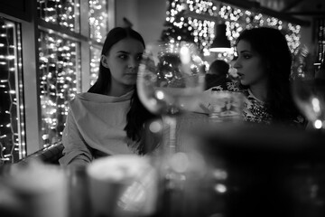 The girl in the evening in a cafe