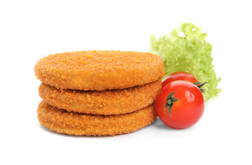 Uncooked breaded cutlets, tomatoes and lettuce on white background. Freshly frozen semi-finished...