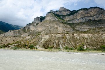 stormy mountain river against the background of the mountain