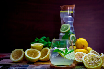 Mojito cocktail, Refreshing summer cocktail with lemon and lime, mint lemonade in a glass and bottle.