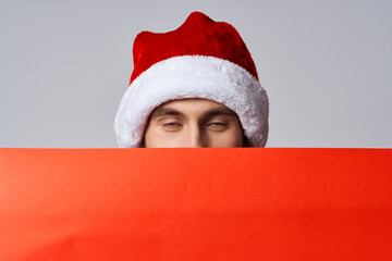 handsome man Red paper billboard advertising christmas light background