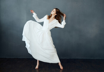 woman in white dress dance posing performance glamor