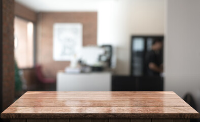 Empty wooden table top with lights bokeh on blur restaurant background.