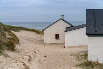 Stenbjerg Landingsplads, a small idyllic fishing village on a beach and between the high dunes, Thy...
