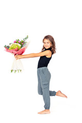 Cute girl child with a bouquet of flowers on a white background in the studio