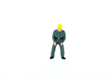 Miniature people engineer worker construction concept on white background