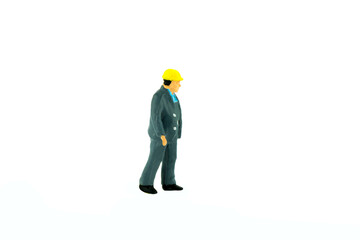 Miniature people engineer worker construction concept on white background