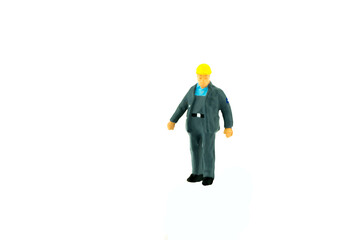 Miniature people engineer worker construction concept on white background