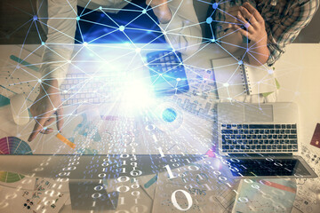 Double exposure of man and woman working together and data theme hologram drawing. Computer background. Top View.