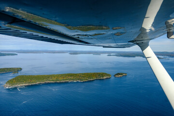 Aerial image of Penobscot Bay and the small islands reflected on the underside of my airplanes Wing