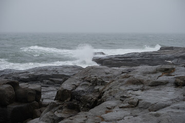 Fototapeta na wymiar Rainstorm and gale force winds at the Nubble Lighthouse on Cape Neddick Maine