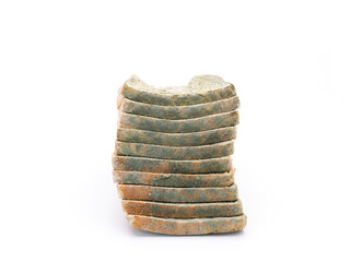 Mouldy bread isolated on white background.