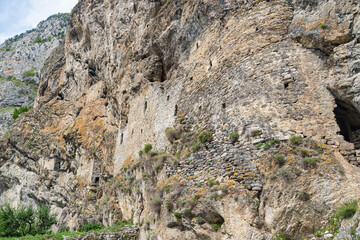The wall of an ancient defensive fortress in the mountains of North Ossetia