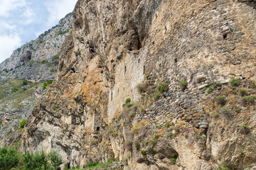The wall of an ancient defensive fortress in the mountains of North Ossetia
