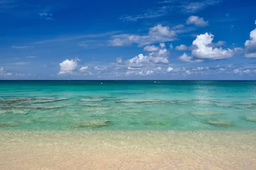 Wall murals Seven Mile Beach, Grand Cayman Crystal clear waters and pinkish sands on empty seven mile beach on tropical carribean Grand Cayman Island