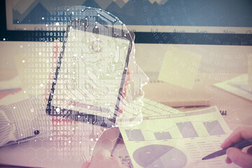 Double exposure of man's hand holding and using a digital device and brain hologram drawing. Data concept.