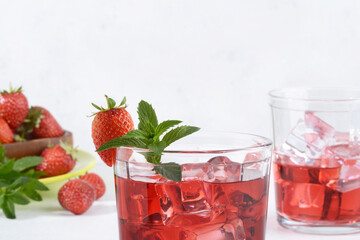  strawberry mint rum cocktail mojito with berries in background