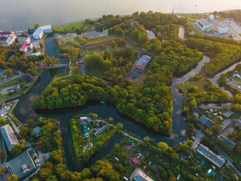 Aerial view of Swedish fortress of Pillau citadel in Baltiysk, Kaliningrad region, Russia at sunset. Drone view.