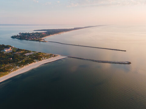 Aerial view of Pillau citadel in Baltiysk, Kaliningrad region, Russia and Baltic spit on Baltic sea at sunset. Drone view