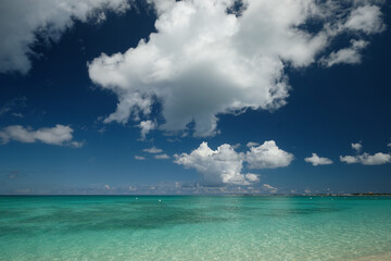 Crystal clear waters and pinkish sands on empty seven mile beach on tropical carribean Grand Cayman Island