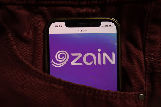 KONSKIE, POLAND - September 04, 2021: Mobile Telecommunications Company KSCP Zain logo on mobile phone hidden in jeans pocket