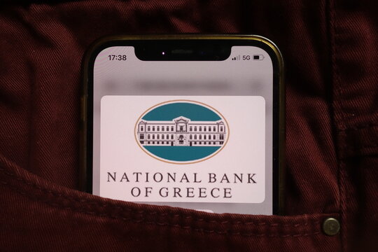 KONSKIE, POLAND - September 04, 2021: National Bank of Greece NBG logo on mobile phone hidden in jeans pocket