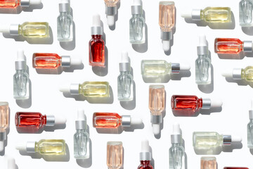 Dropper glass bottles with pipette. Transparent hyaluronic natural beauty mineral product and eco serum skin care concept. Top horizontal view copyspace. Summer juicy colors