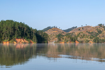 The lake reflects the mountains of Danxia landform