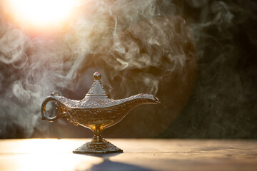 Aladdin lamp of wishes in magic smoke