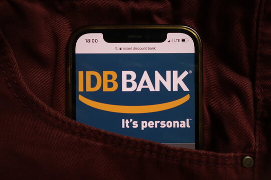 KONSKIE, POLAND - September 04, 2021: Israel Discount Bank IDB logo on mobile phone hidden in jeans pocket